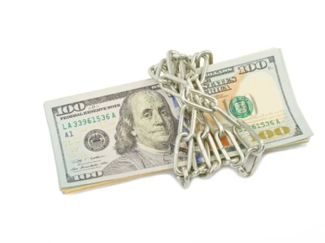 dollar bills with chain and lock